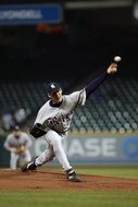 baseball player in a deep throw