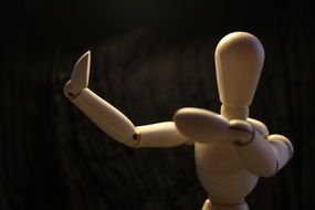 wooden figure in dance