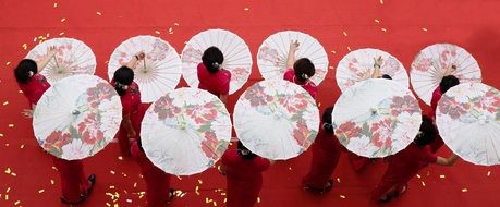 girls dancing with umbrellas