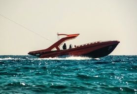 paragliding on a speed boat over water