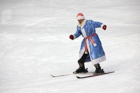 photo of skiing santa claus in winter