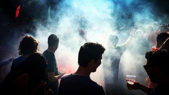 Group of people in the white smoke