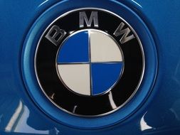 BMW logo on blue car closeup