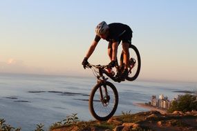 cyclist rides on a rocky road