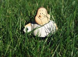 Football Player toy in the grass