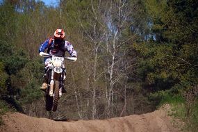 motorcycle racer jumping on the track