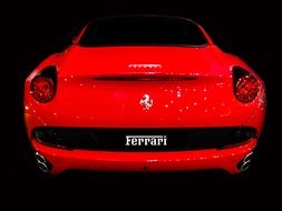 red sports car in the dark background