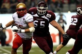 football players in equipment on the field