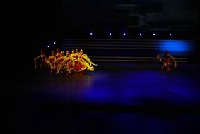 dance performance in colorful costumes on stage