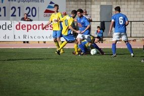 playing football teams on a stadium