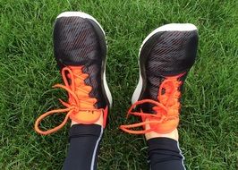 Orange and black running shoes