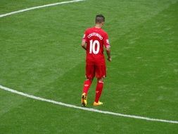 Soccer player on a green field