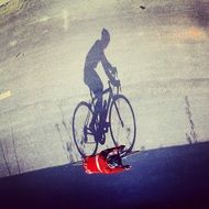 shadow of a cyclist on a sunny day