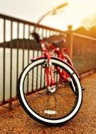 red bicycle on the bridge