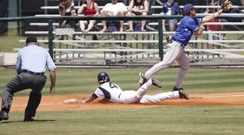 Baseball player lies on the field during the game