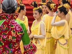 Chinese dancers in yellow costumes