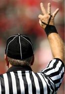 photo of the back of a football referee