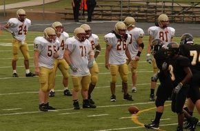 two teams on the field in american football