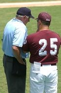 baseball player with a coach on the field