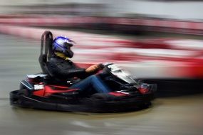 photo of an athlete on an electric car at high speed