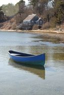 panoramic view of a blue canoe on the water