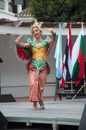 female dance in a traditional costume on stage