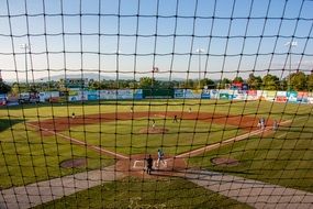 view through the net on a baseball field