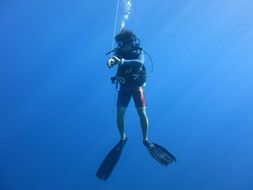 Diver Scuba in the blue sea
