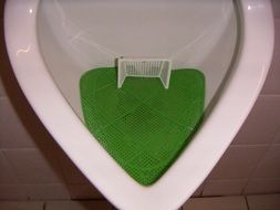 football in a urinal