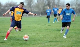 attack with a ball on a soccer field