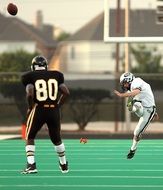 football player throw in white uniform