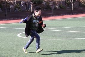 children's running on the stadium
