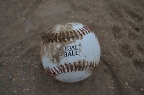 baseball ball in the sand