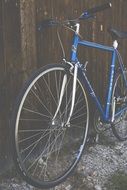 vintage bicycle near a wooden fence