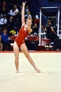 Gymnastics Competition, girl in red clothing on Carpet