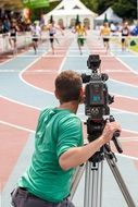 operator shoots track and field competitions