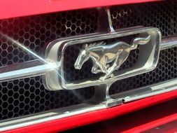 chrome details of a red sports car close-up