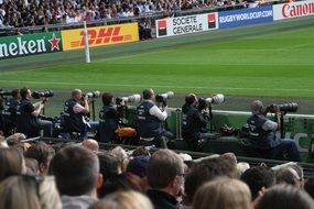 paparazzi on a football stadium