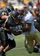 clash of players on the field in american football