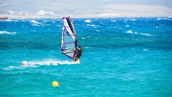 windsurfing on the blue sea