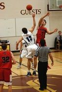 basketball game in gymnasium