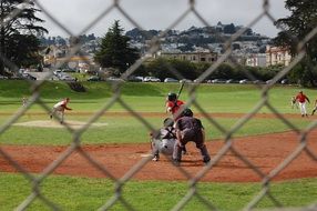 baseball training on the field behind the fence