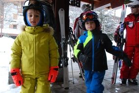 children in ski suits