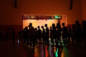 silhouettes on dance floor