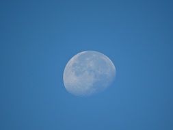 full white moon in the blue sky