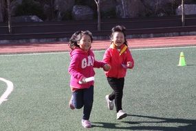 two little girls in the stadium