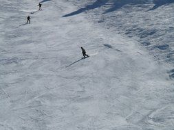 panoramic view of skiers on the track on a sunny day