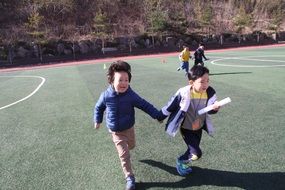 children as sportsmen in the stadium