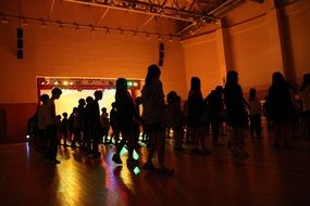 silhouettes of young dancers