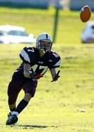 ball and player in american football